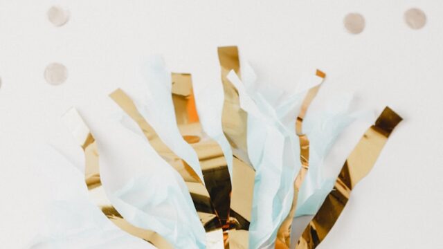 white and brown foil party decor on white panel